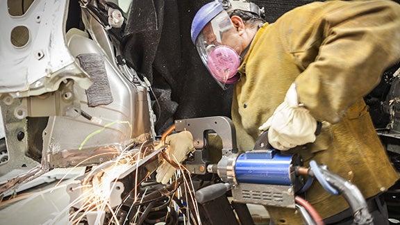 Collision Center Technician Repairing Vehicle | Bergeron Toyota in Iron Mountain MI