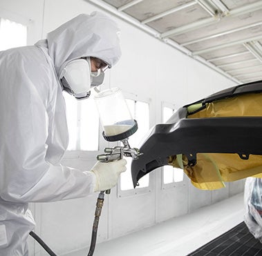 Collision Center Technician Painting a Vehicle | Bergeron Toyota in Iron Mountain MI